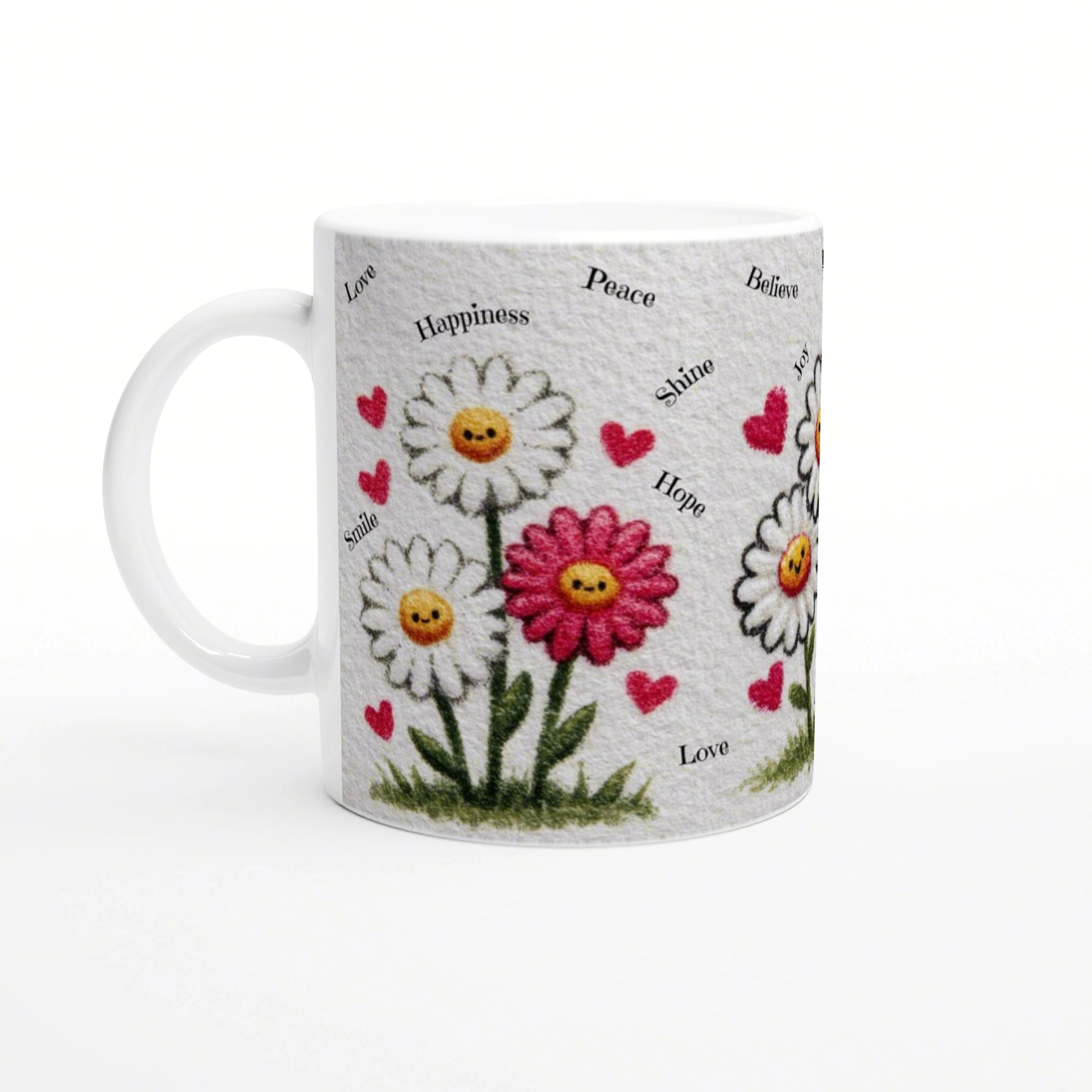 White mug with daisies, yellow smiley centers, pink hearts, and words like Love, Happiness, Peace.