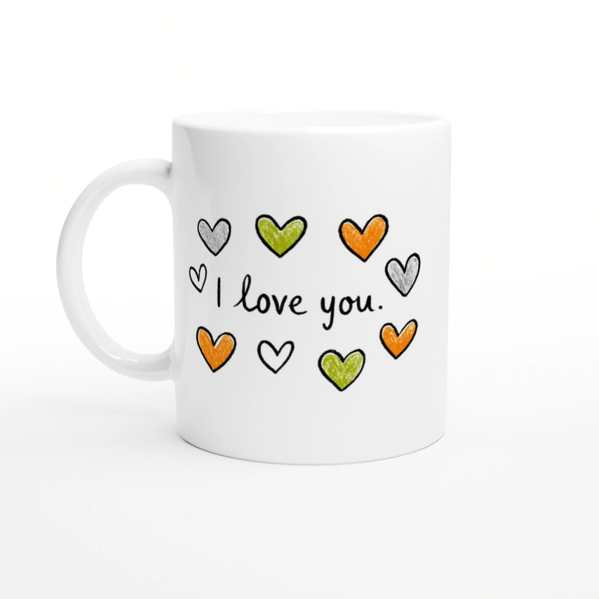 White mug featuring hand-drawn orange, green, and gray hearts around the phrase 'I love you'.