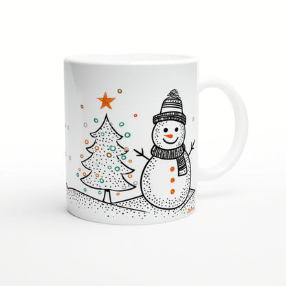 White mug with a doodle illustration of a smiling snowman in a hat and scarf beside a decorated Christmas tree.