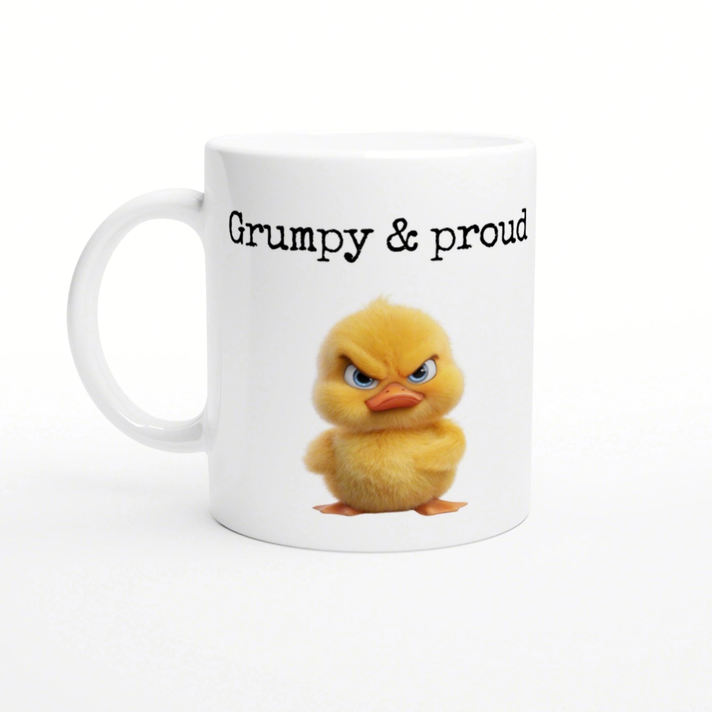 White ceramic mug with a fluffy yellow chick illustration and the caption 'Grumpy & proud' in black lettering.