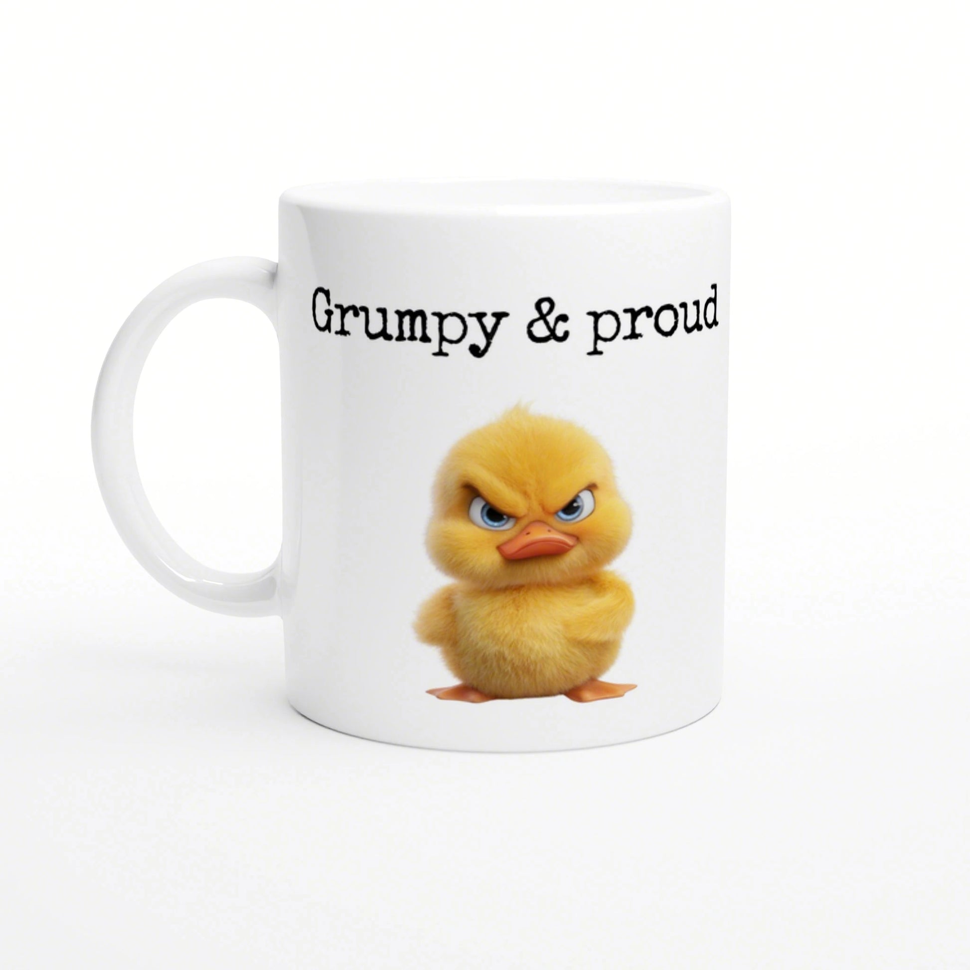 White ceramic mug with a fluffy yellow chick illustration and the caption 'Grumpy & proud' in black lettering.
