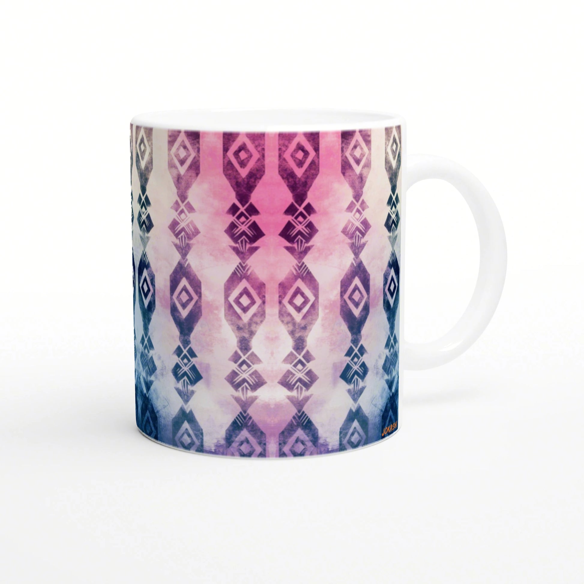 White ceramic mug with a vertical diamond pattern in a pink-to-blue gradient, a colorful geometric design.