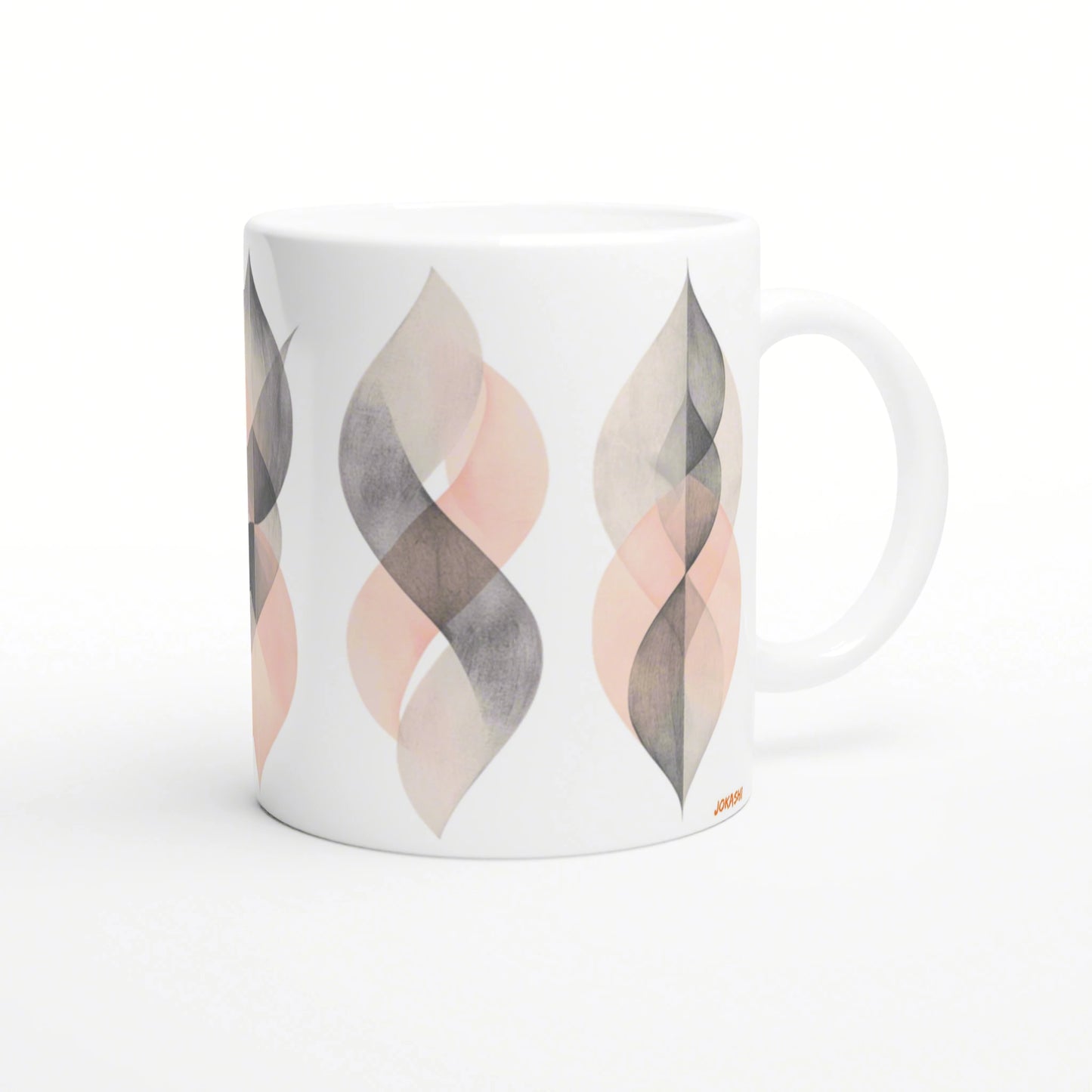 White ceramic mug mockup with a repeating peach and gray geometric leaf pattern around the cup.