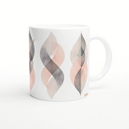 White ceramic mug mockup with a repeating peach and gray geometric leaf pattern around the cup.