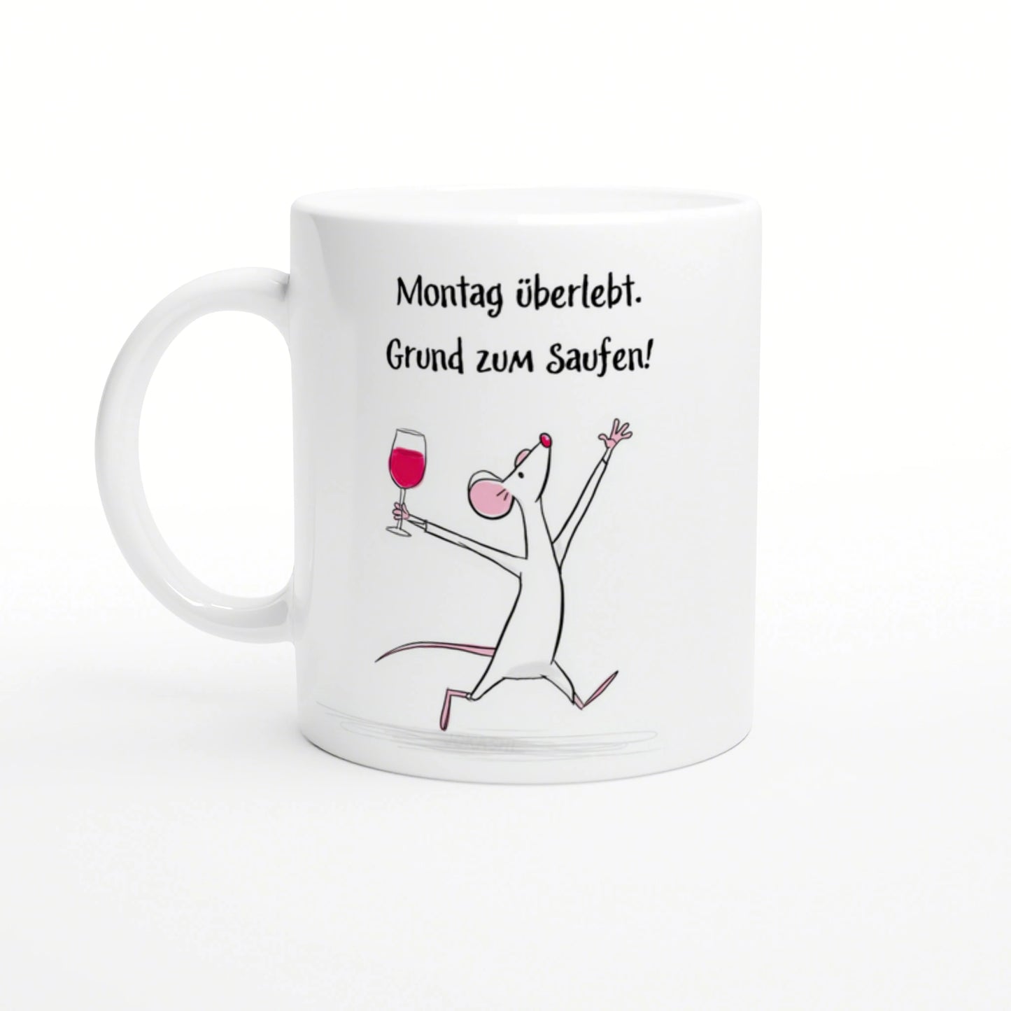 White mug featuring the German slogan 'Montag überlebt. Grund zum Saufen!' with a cheerful cartoon mouse raising a wine glass.
