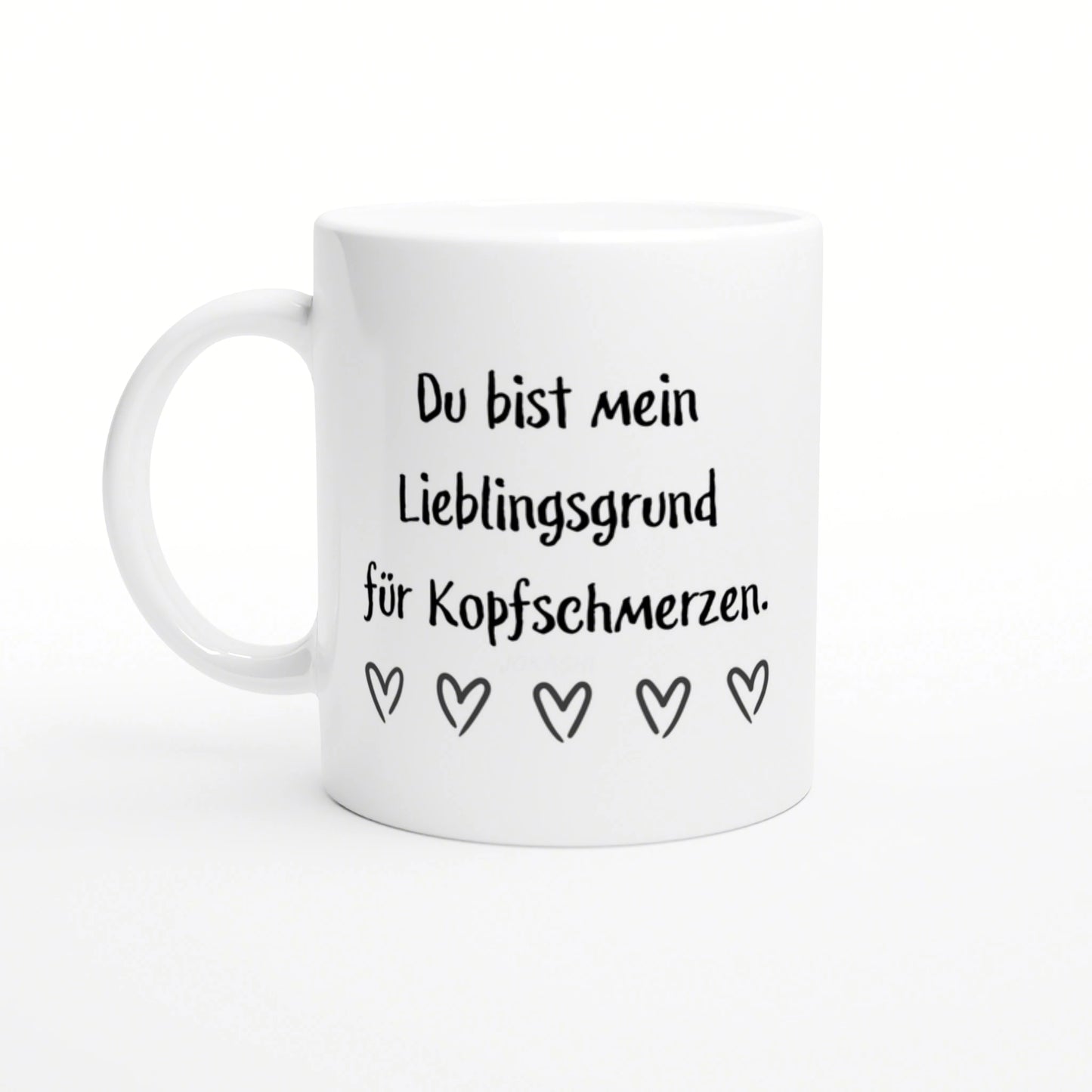 White ceramic mug mockup with black German text 'Du bist mein Lieblingsgrund fuer Kopfschmerzen' and five outlined hearts.