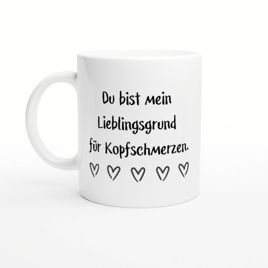 White ceramic mug mockup with black German text 'Du bist mein Lieblingsgrund fuer Kopfschmerzen' and five outlined hearts.