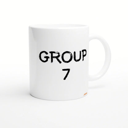 White ceramic mug with bold distressed black text GROUP 7 on the front; product mockup for a novelty mug.