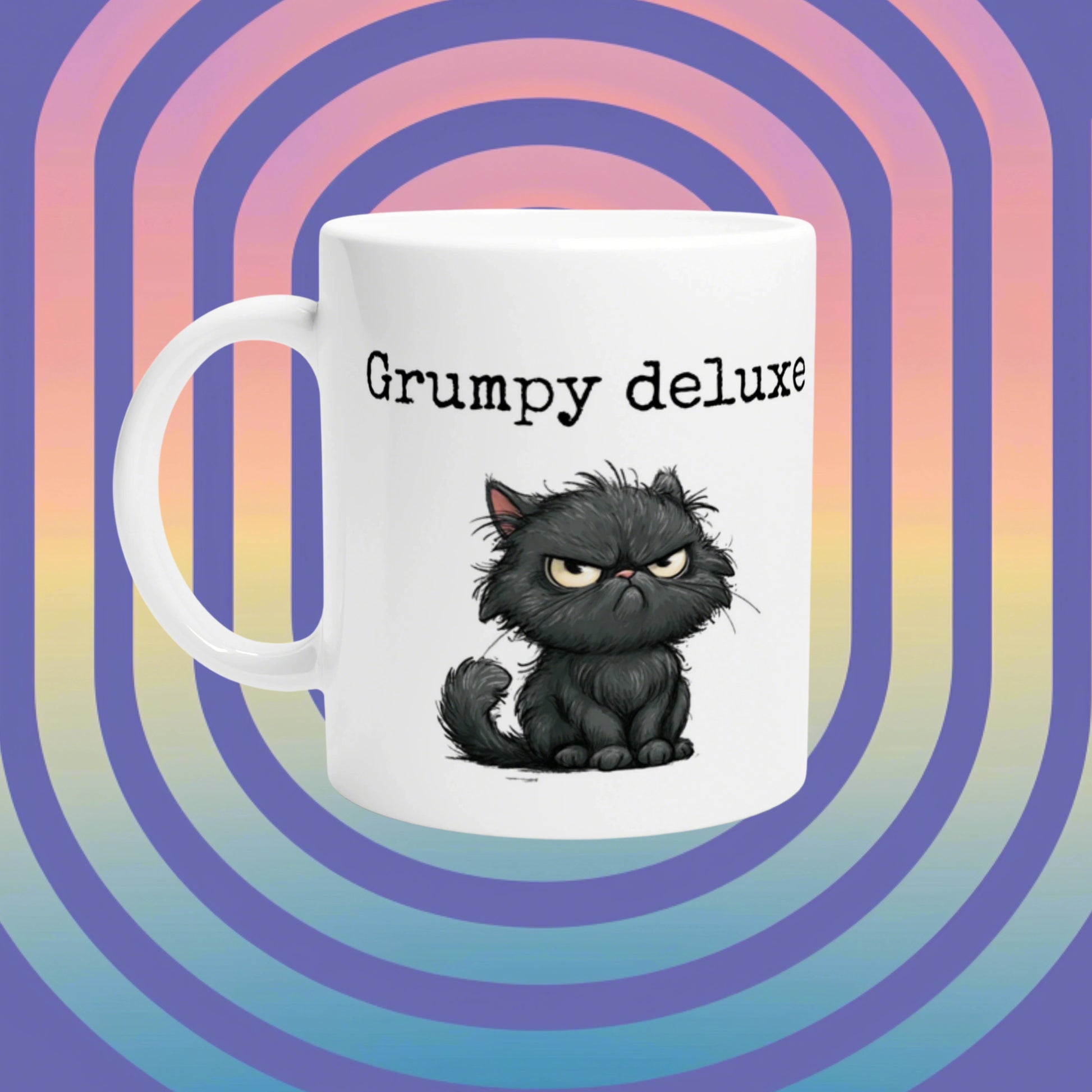 White ceramic mug featuring a grumpy black cat illustration and the text 'Grumpy deluxe' on a bright retro gradient background.