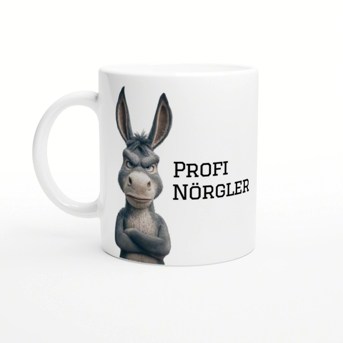 White mug featuring a grumpy cartoon donkey with crossed arms and the text PROFI NÖRGLER.
