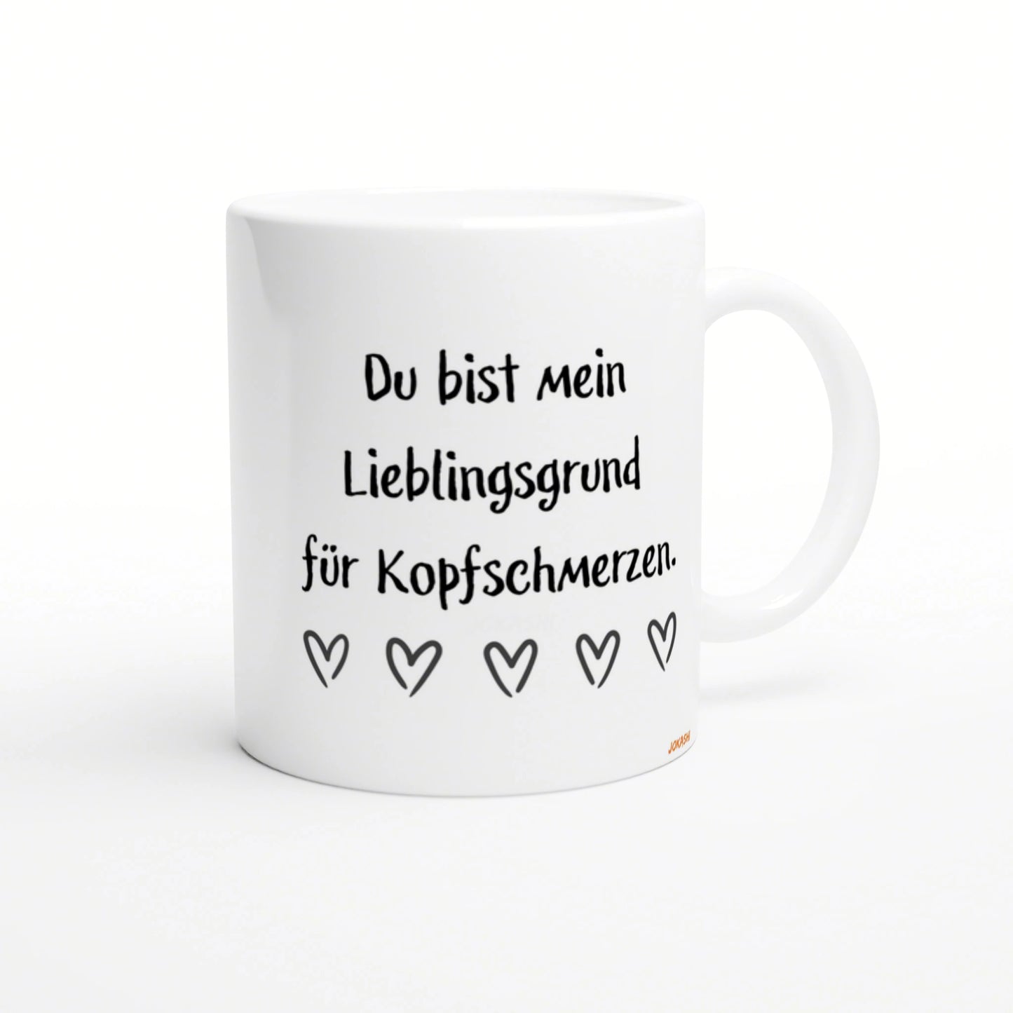 White mug with black handwritten German text Du bist mein Lieblingsgrund fuer Kopfschmerzen and a row of five heart doodles.