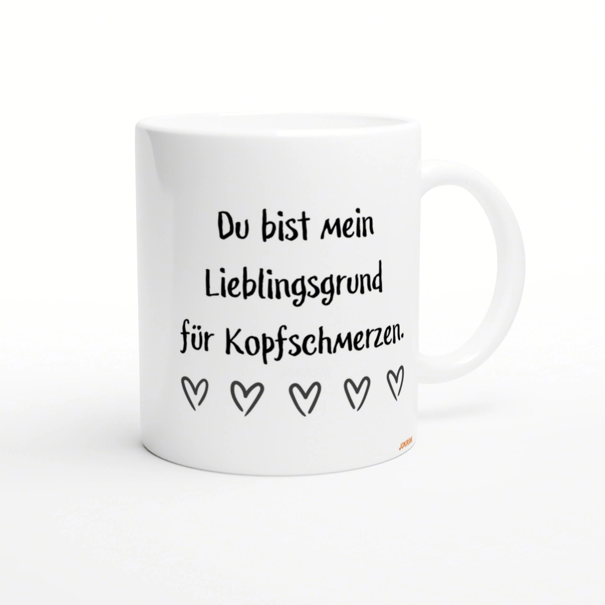 White mug with black handwritten German text Du bist mein Lieblingsgrund fuer Kopfschmerzen and a row of five heart doodles.