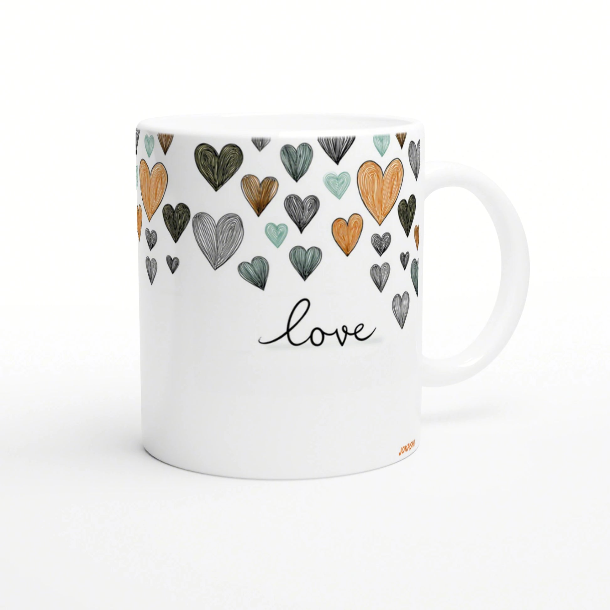 White mug with colorful hand-drawn hearts around the top and the word love in cursive, a product mockup for an online shop.