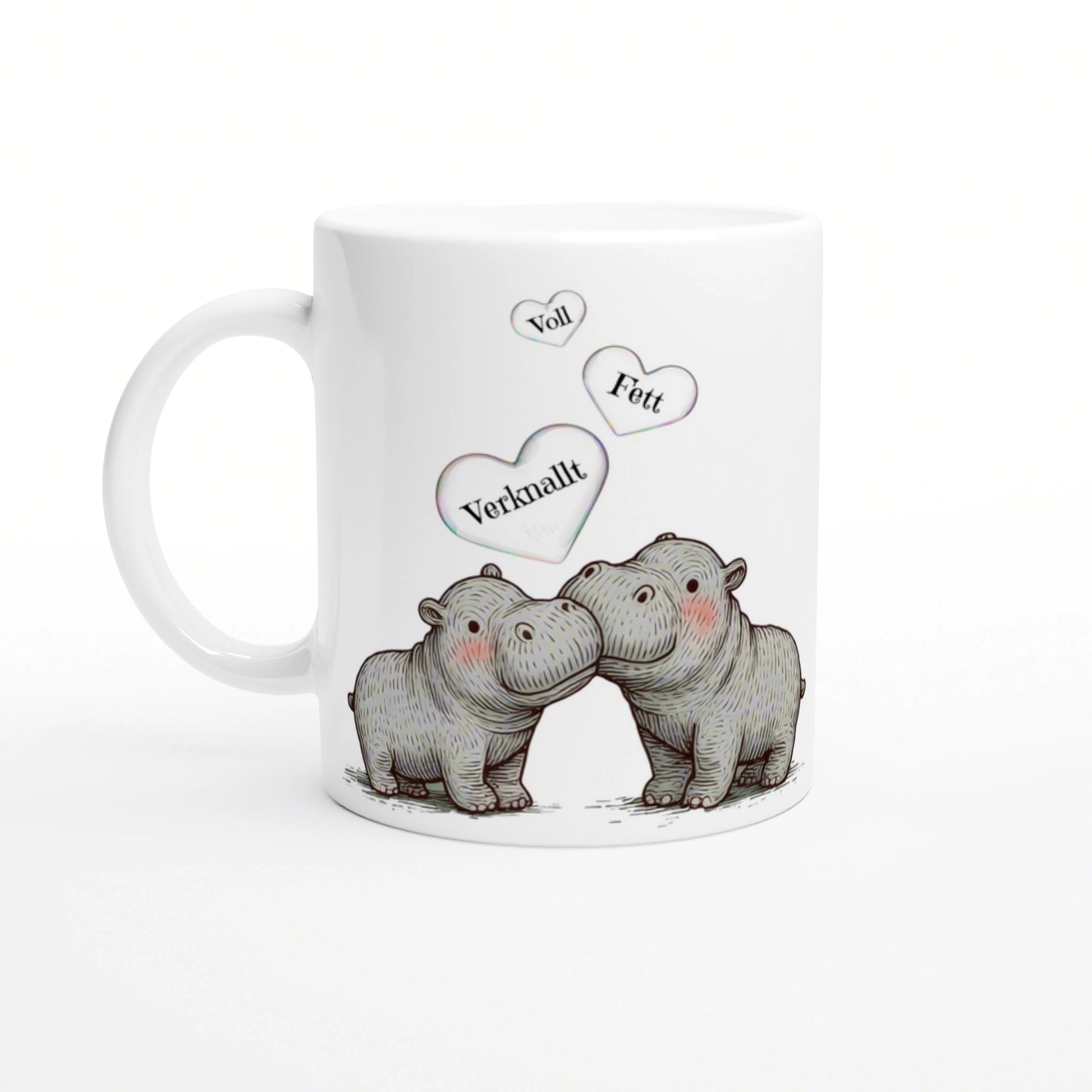 White mug with a sketch of two cuddling hippos and three floating hearts labeled Voll, Fett, Verknallt.