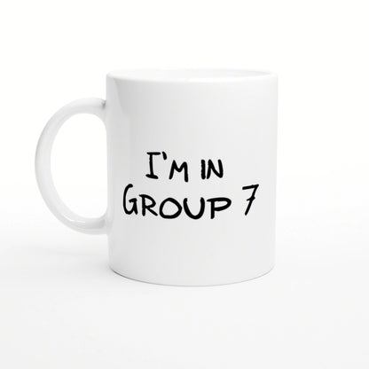 White ceramic mug featuring black handwritten text 'I'M IN GROUP 7'.
