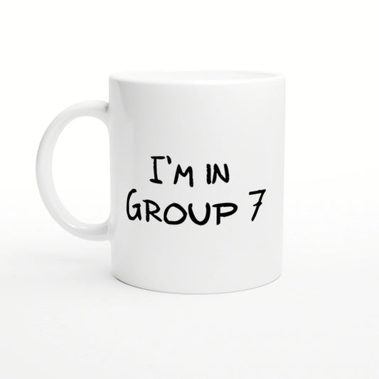 White ceramic mug featuring black handwritten text 'I'M IN GROUP 7'.