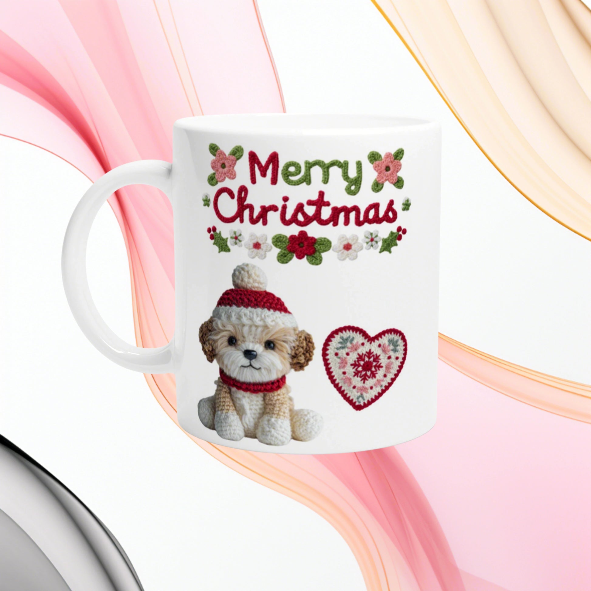 White mug featuring a knitted puppy in a red hat and scarf, "Merry Christmas" with a floral border and a heart motif.