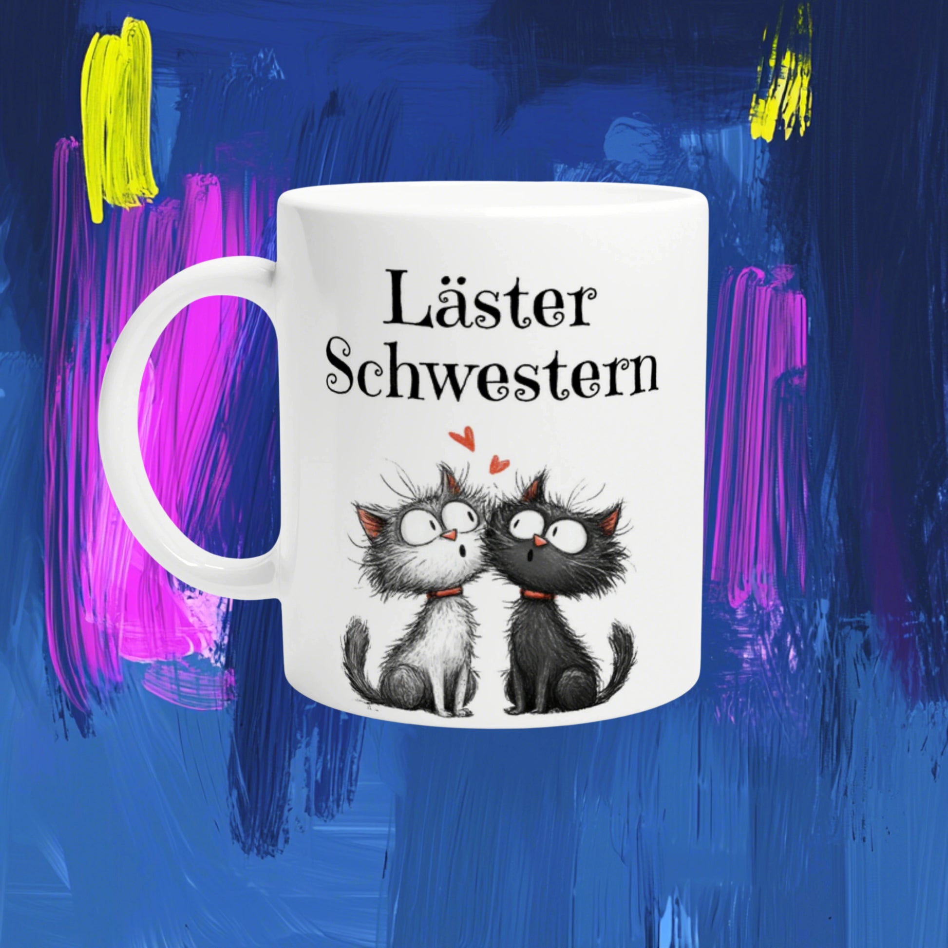 White ceramic mug mockup with the German text 'Läster Schwestern' and two cuddling cartoon kittens on a blue abstract background.