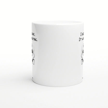 White ceramic mug mockup with partial black line-art on the sides, hinting at humorous slogans; product image for an online shop.