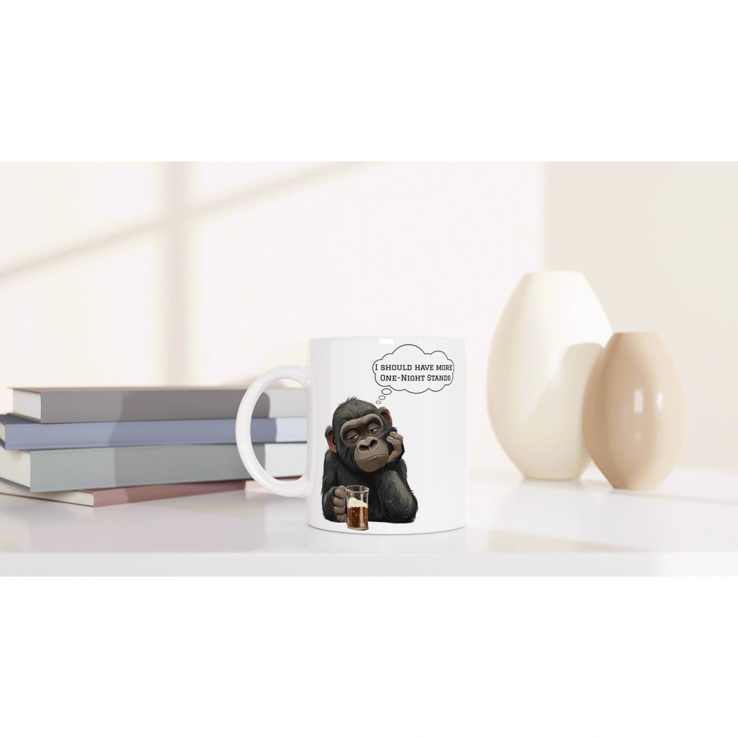 White mug mockup featuring a cartoon chimp holding a drink and thinking I should have more one-night stands with books.