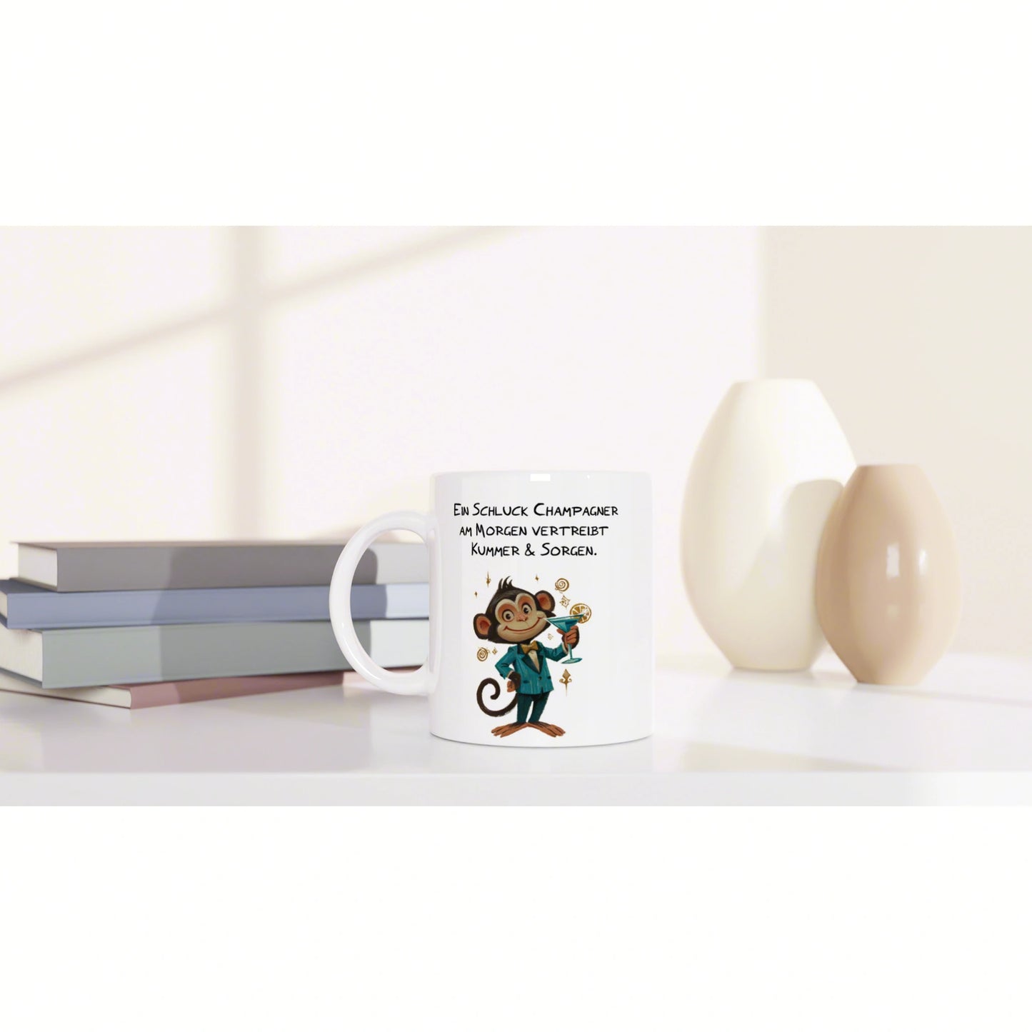 White mug mockup featuring a cartoon monkey with champagne and a German slogan; stacked books on the left, decorative vases on the right.