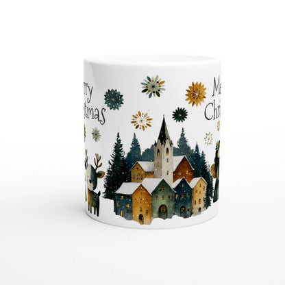 White mug mockup with a Christmas village, snow-covered houses, pines, and snowflakes; partial Merry Christmas text.