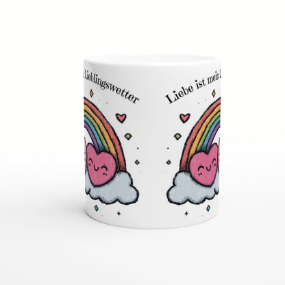 White mug mockup featuring a rainbow with pink heart-clouds, mirrored on both sides, and curved German text along the rim.