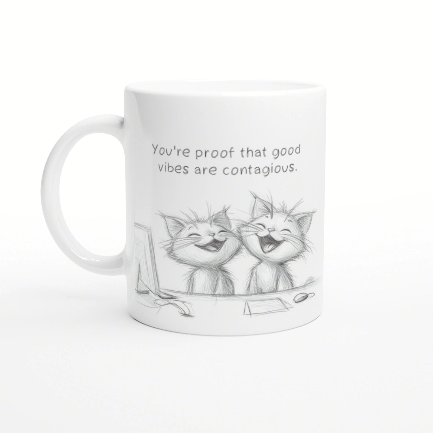 White mug mockup featuring a pencil sketch of two laughing cats and the slogan 'You're proof that good vibes are contagious.'
