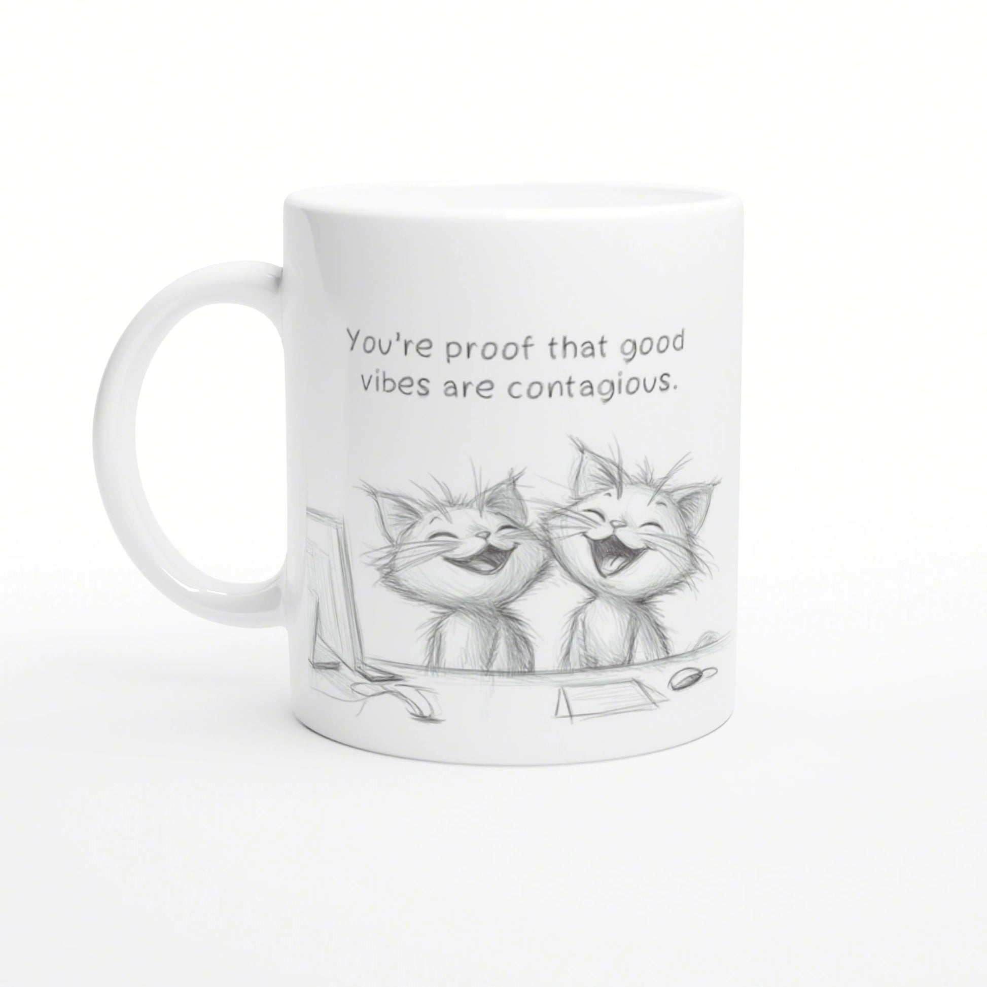 White mug mockup featuring a pencil sketch of two laughing cats and the slogan 'You're proof that good vibes are contagious.'