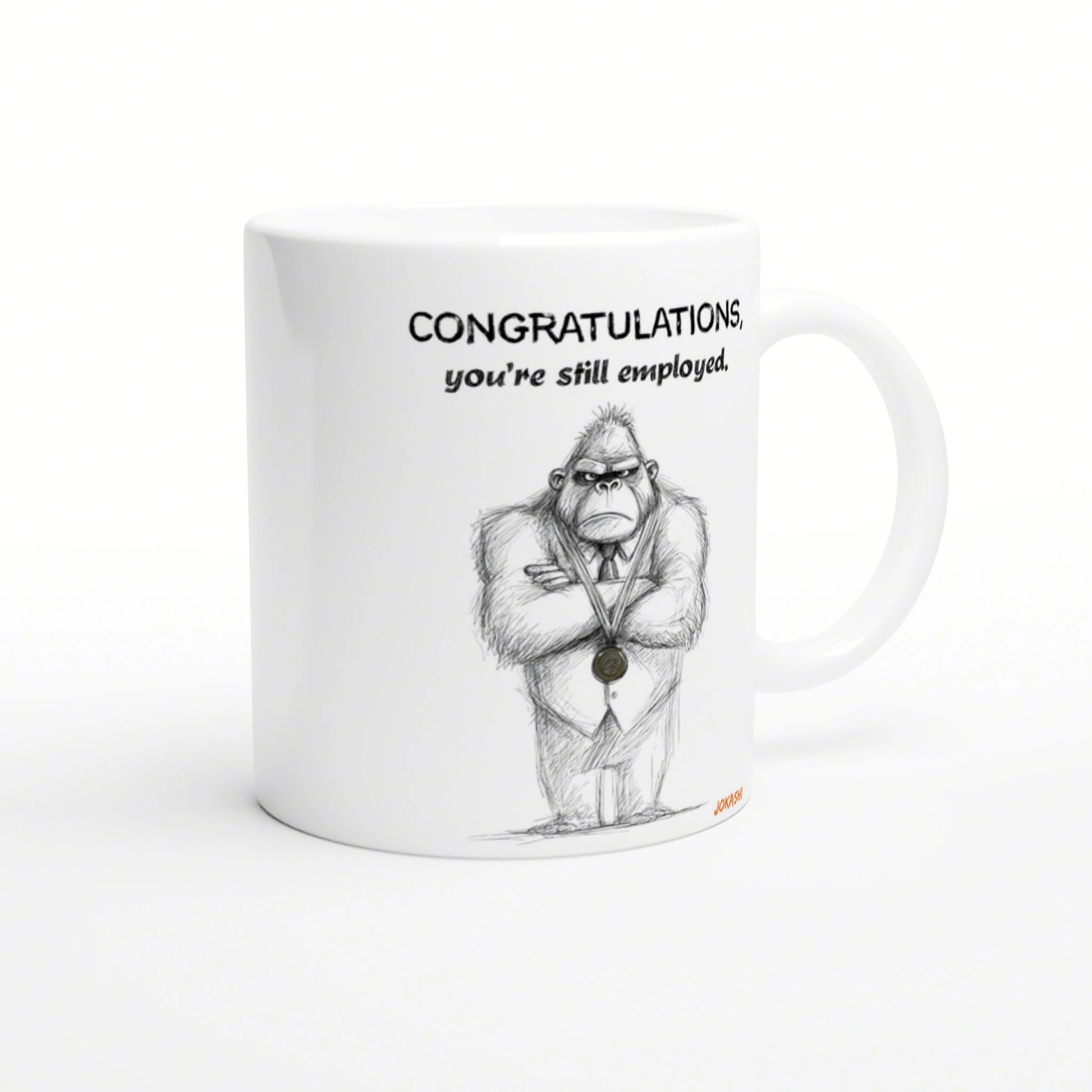 White mug mockup with a sketch of a gorilla in a suit wearing a medal and the caption CONGRATULATIONS, you're still employed.