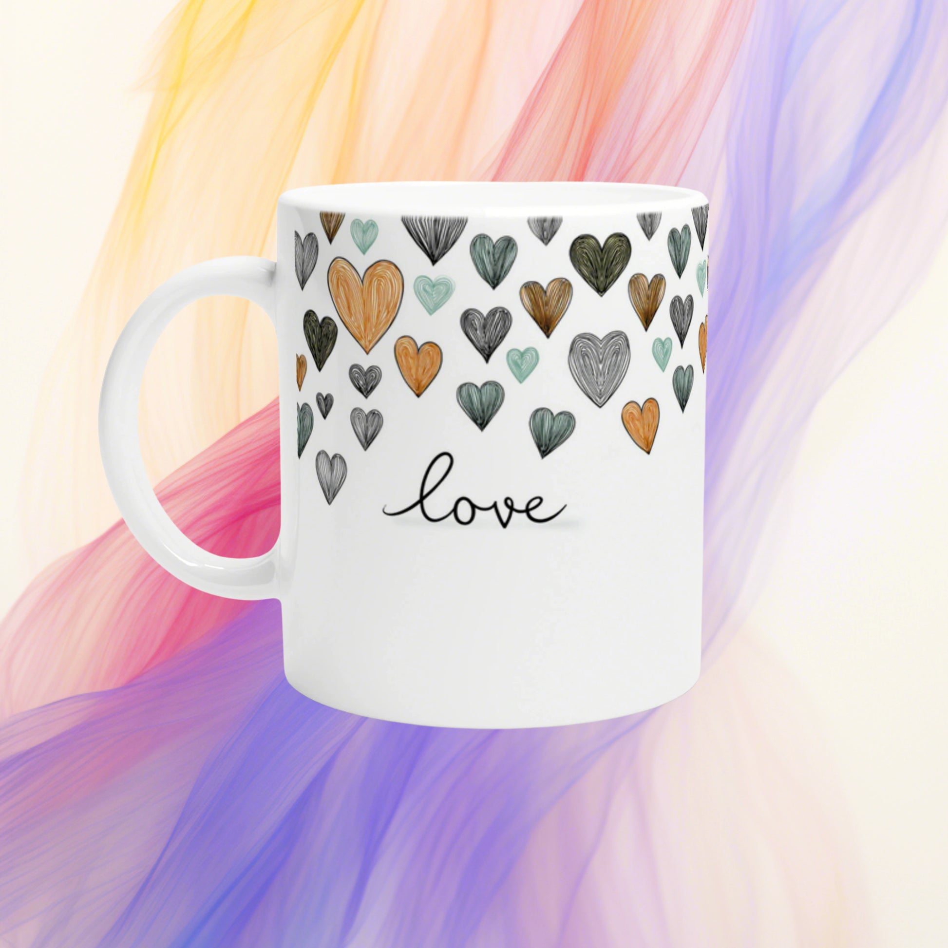 White mug with hand-drawn multicolor hearts and the word love in cursive; light pastel background.