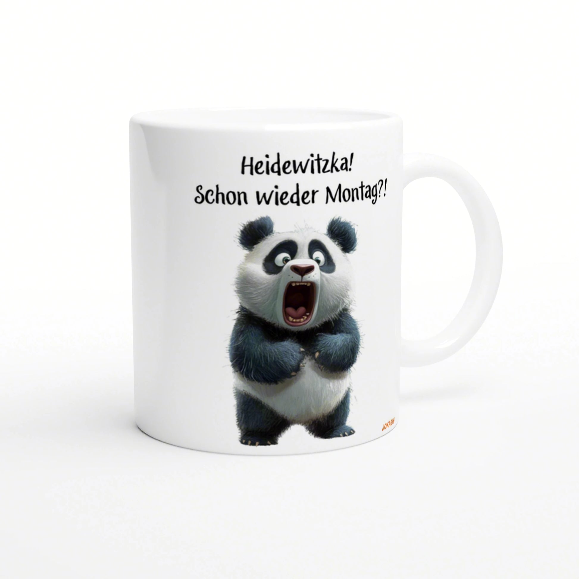 White ceramic mug featuring a wide-eyed panda and the German caption Heidewitzka! Schon wieder Montag?!