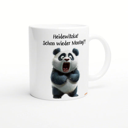 White ceramic mug featuring a wide-eyed panda and the German caption Heidewitzka! Schon wieder Montag?!
