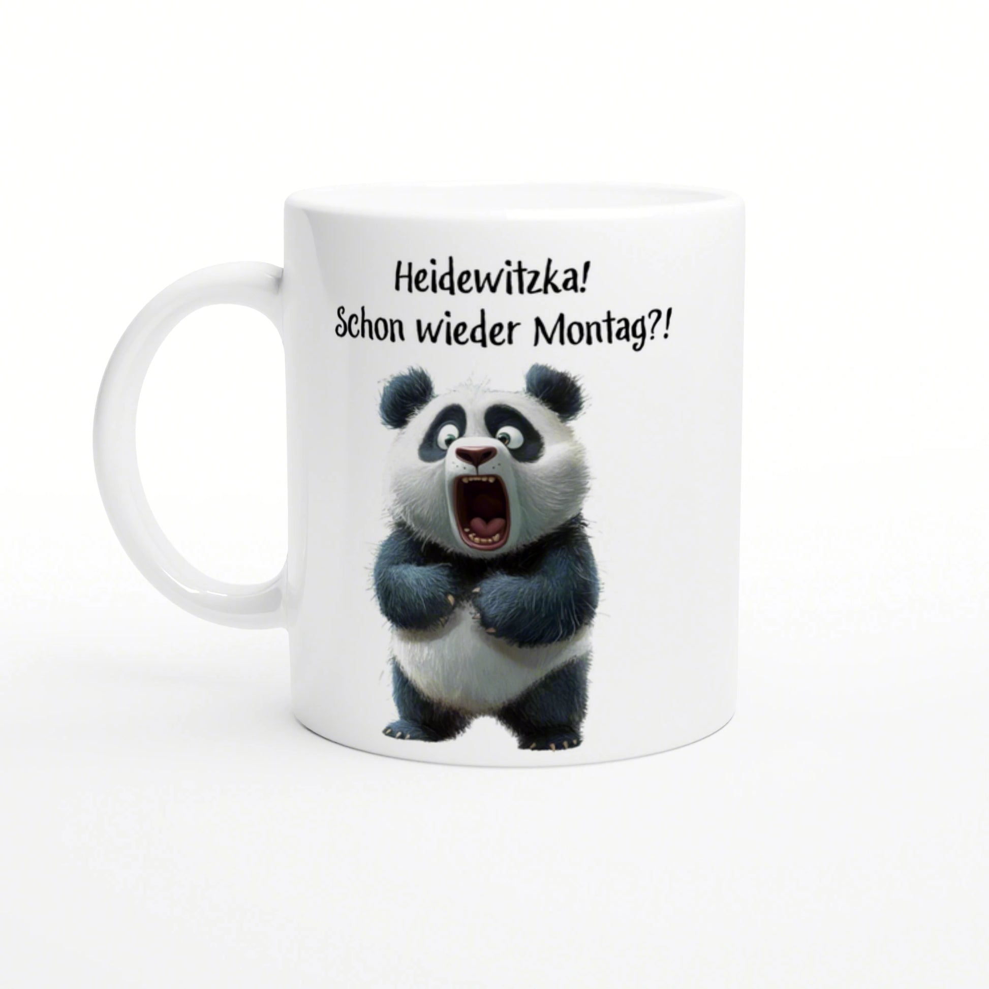 White mug mockup with a surprised panda and the German caption 'Heidewitzka! Schon wieder Montag?!'
