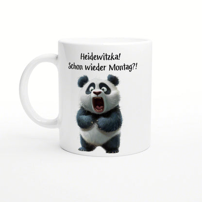 White mug mockup with a surprised panda and the German caption 'Heidewitzka! Schon wieder Montag?!'
