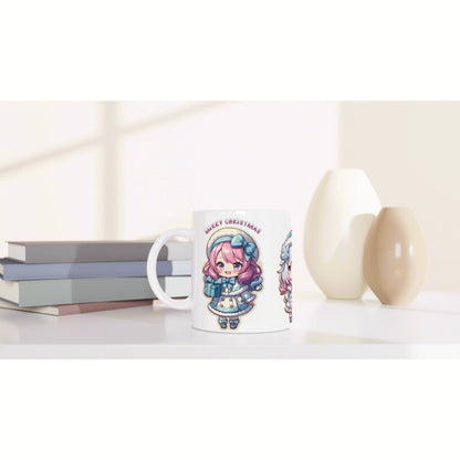 White mug with pastel anime girl illustration and Merry Christmas text, shown with books and decorative vases.