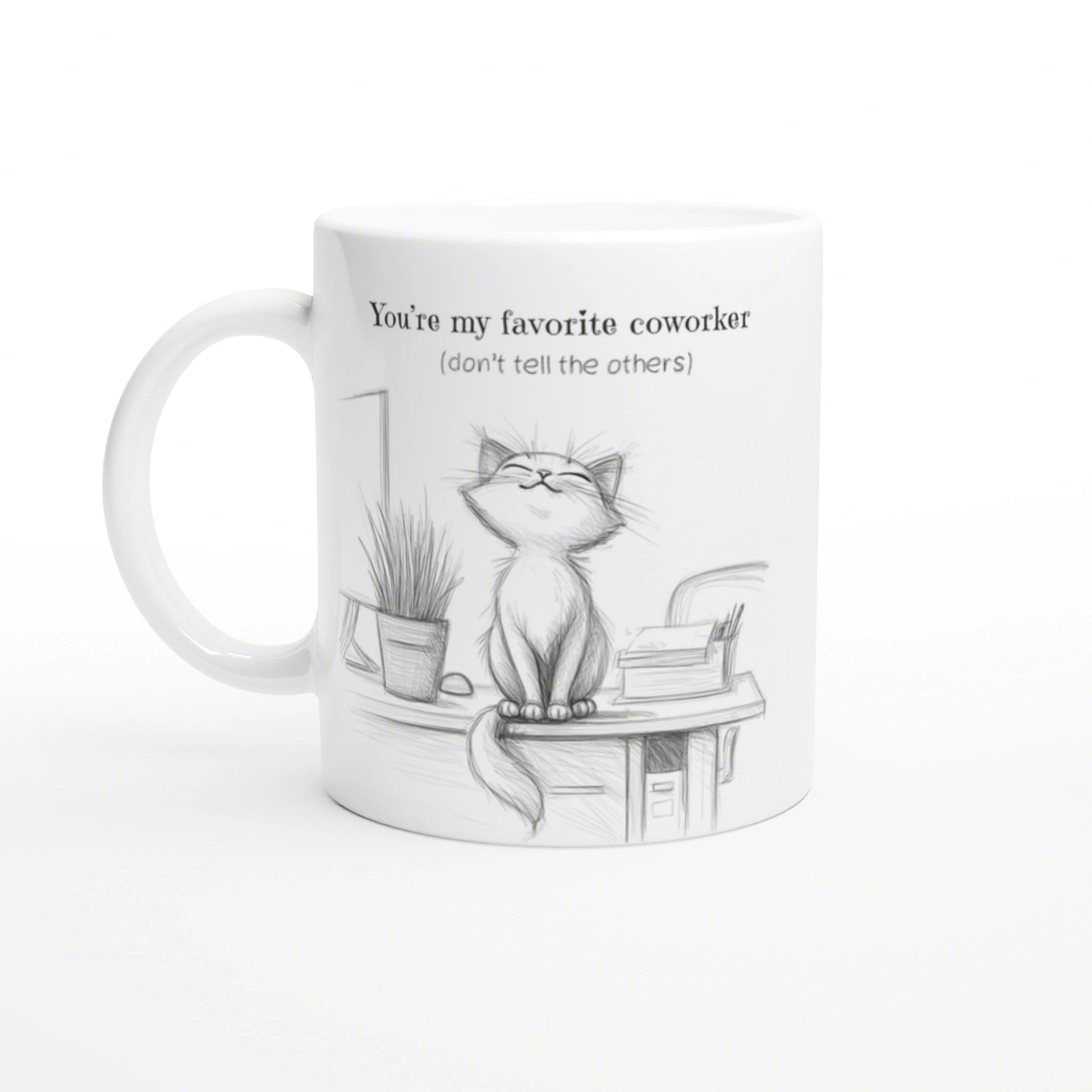 White mug with a pencil sketch of a cat on a desk, plant and books; You're my favorite coworker (don't tell the others).