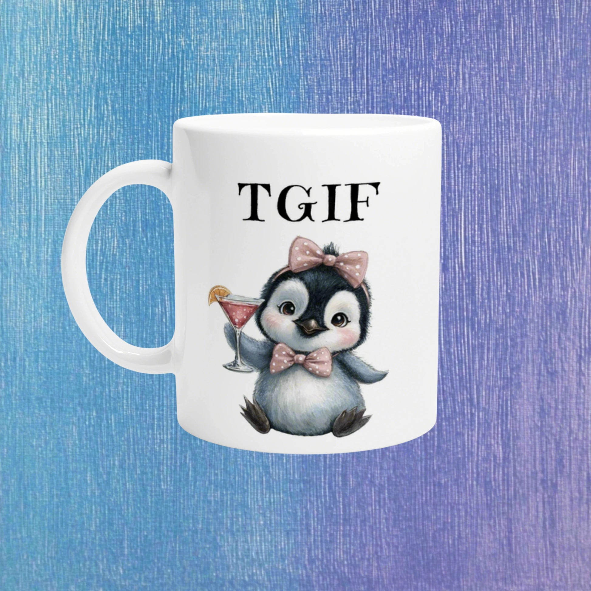 White ceramic mug featuring a cute penguin with pink bow and bow tie, holding a cocktail, and TGIF text; product mockup