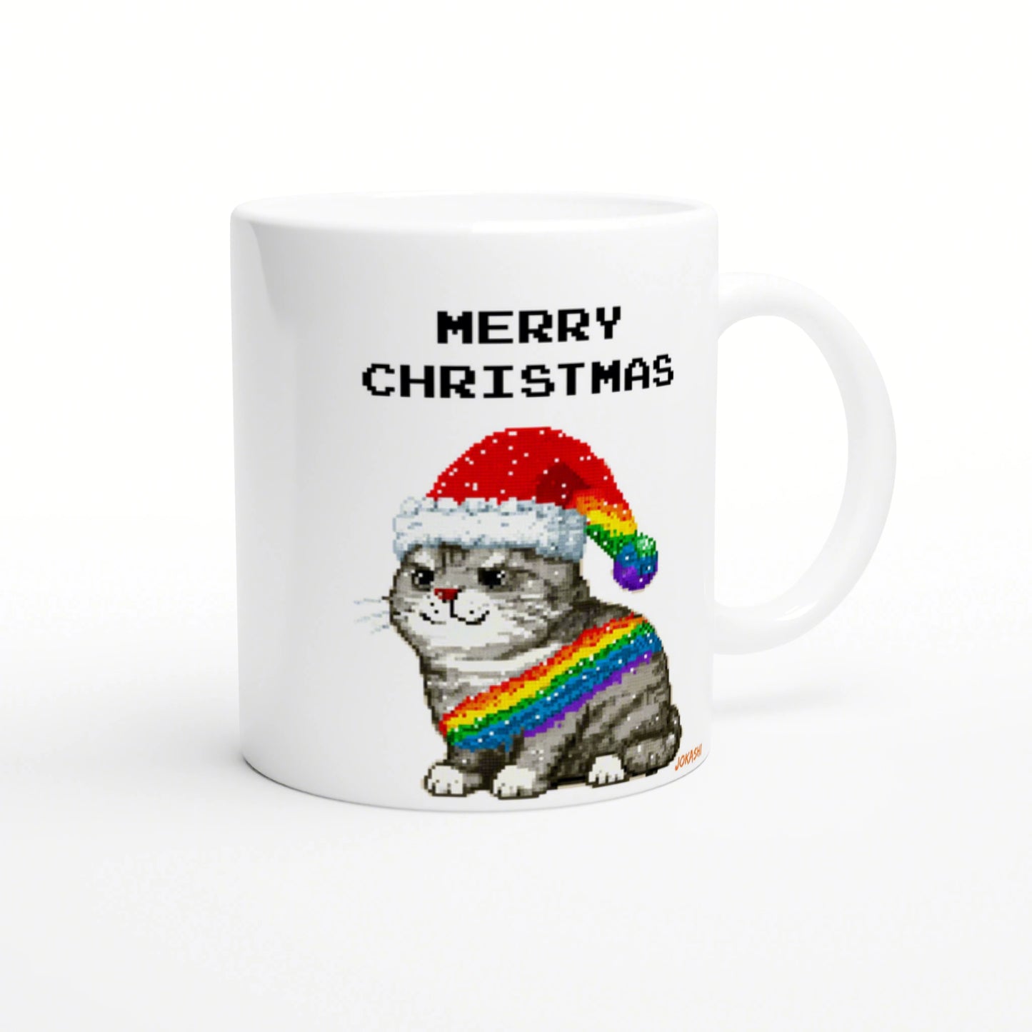 White ceramic mug featuring a pixel-art cat wearing a Santa hat and a rainbow scarf, with the words MERRY CHRISTMAS.