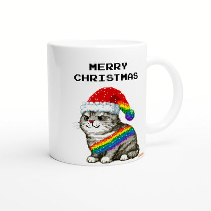 White ceramic mug featuring a pixel-art cat wearing a Santa hat and a rainbow scarf, with the words MERRY CHRISTMAS.