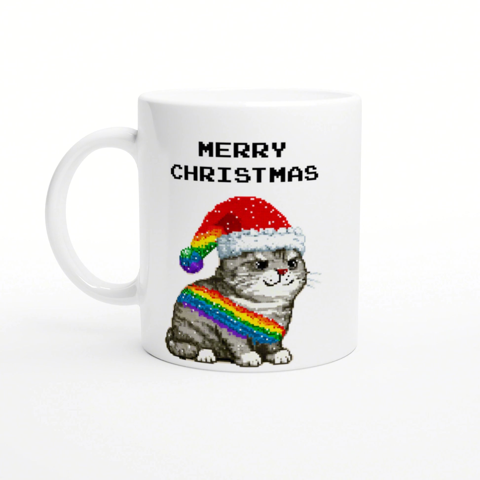 White mug with a pixel-art gray cat wearing a Santa hat and rainbow scarf, with MERRY CHRISTMAS text above.