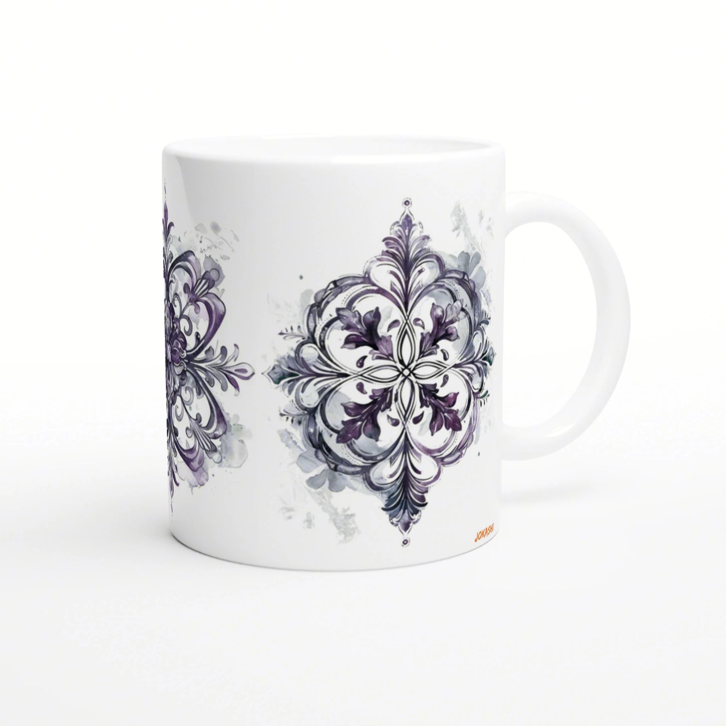 White ceramic mug with a purple ornamental mandala design along its side, shown as a product mockup.