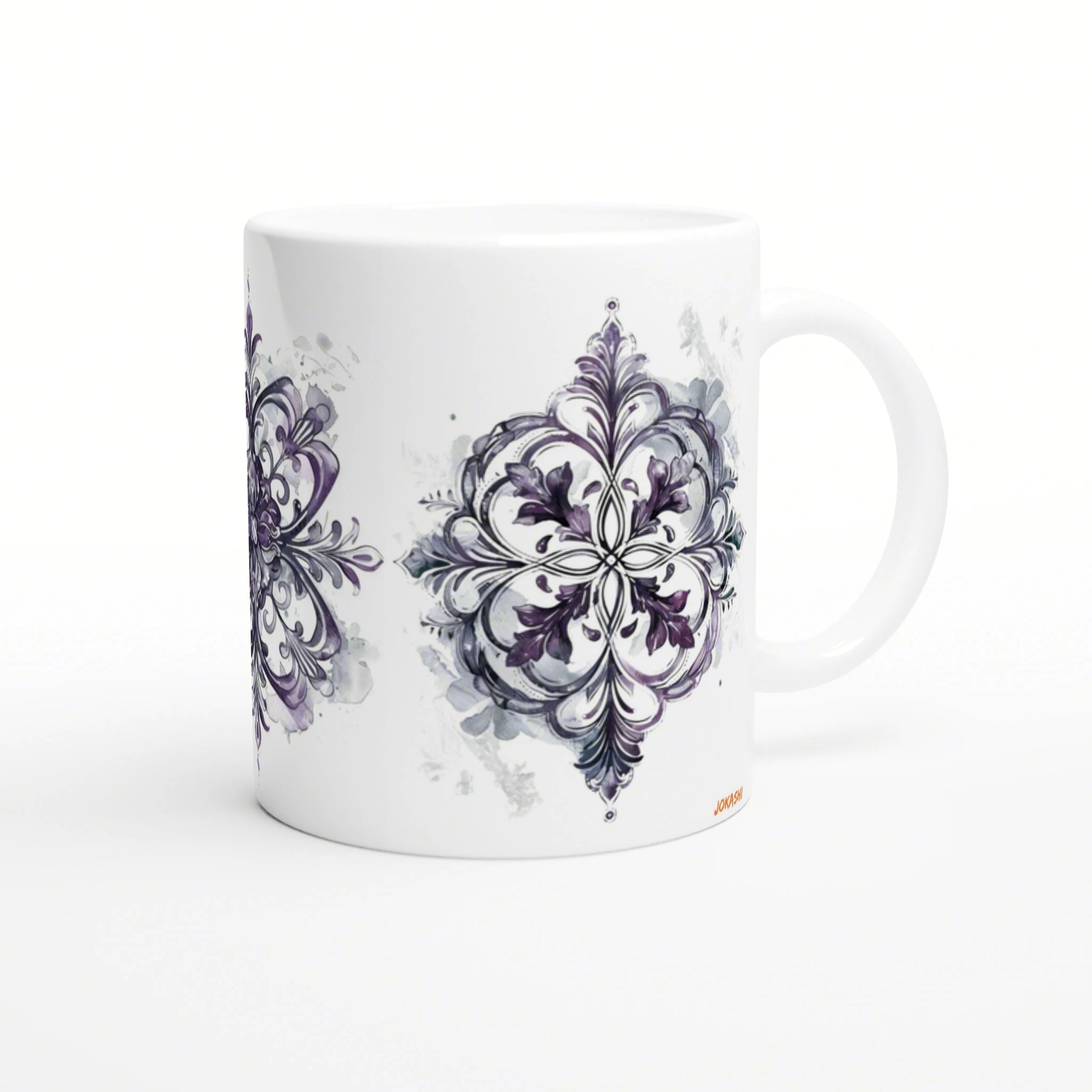 White ceramic mug with a purple ornamental mandala design along its side, shown as a product mockup.