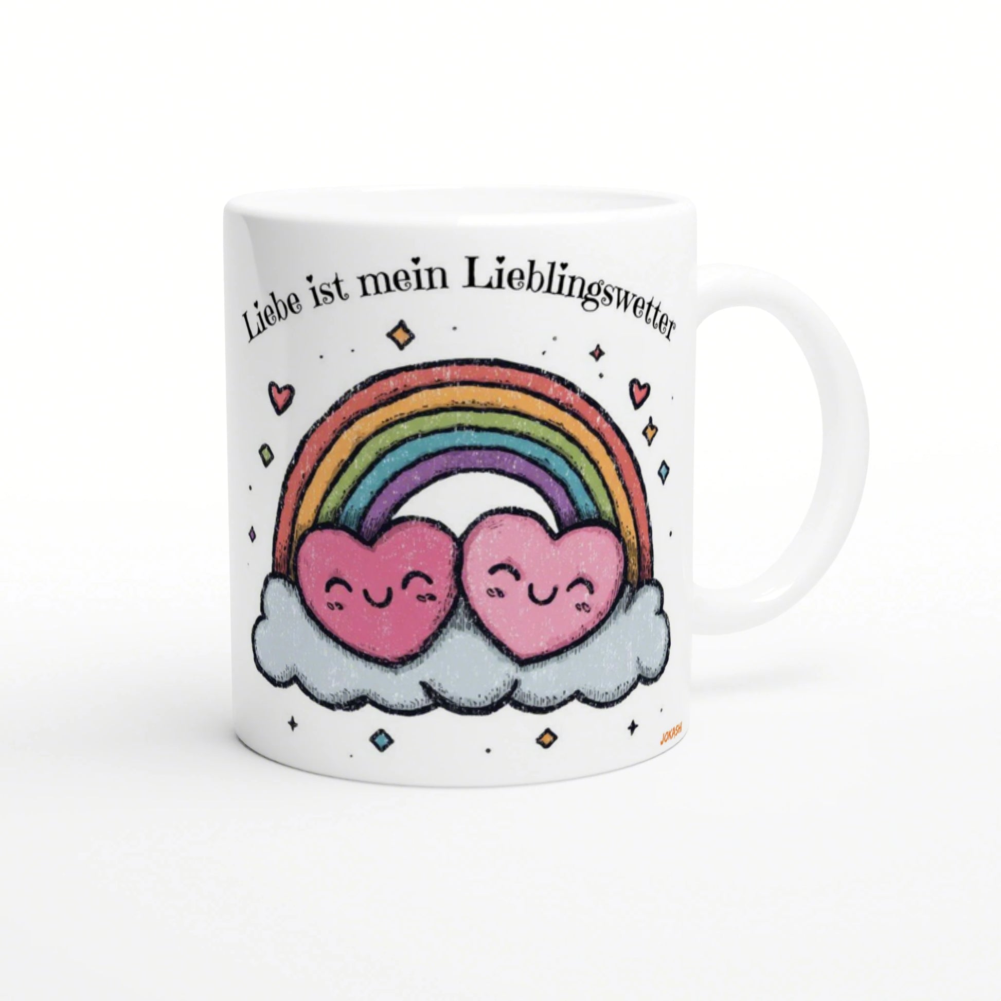 White mug featuring a rainbow arch, two smiling pink hearts on clouds, and the German caption Liebe ist mein Lieblingswetter.