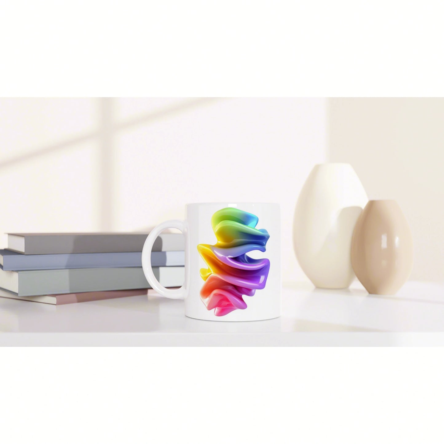 White mug with a vibrant rainbow swirl design, shown as a product mockup on a desk with books and decorative vases.