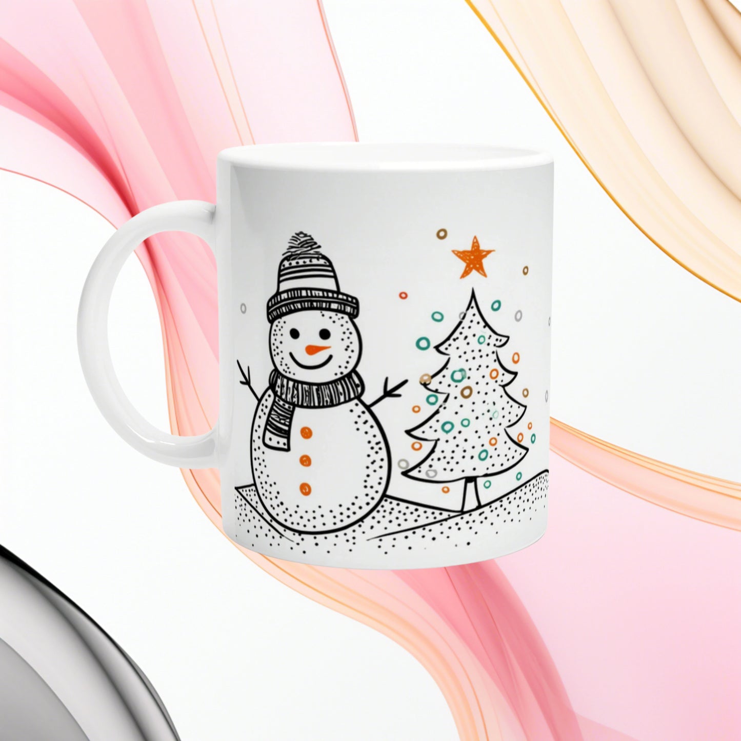 White mug with a playful black line drawing of a snowman in a hat and scarf beside a decorated Christmas tree.