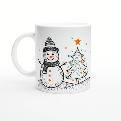 White mug featuring a playful black-and-white sketch of a snowman in a knit hat and scarf beside a decorated Christmas tree.