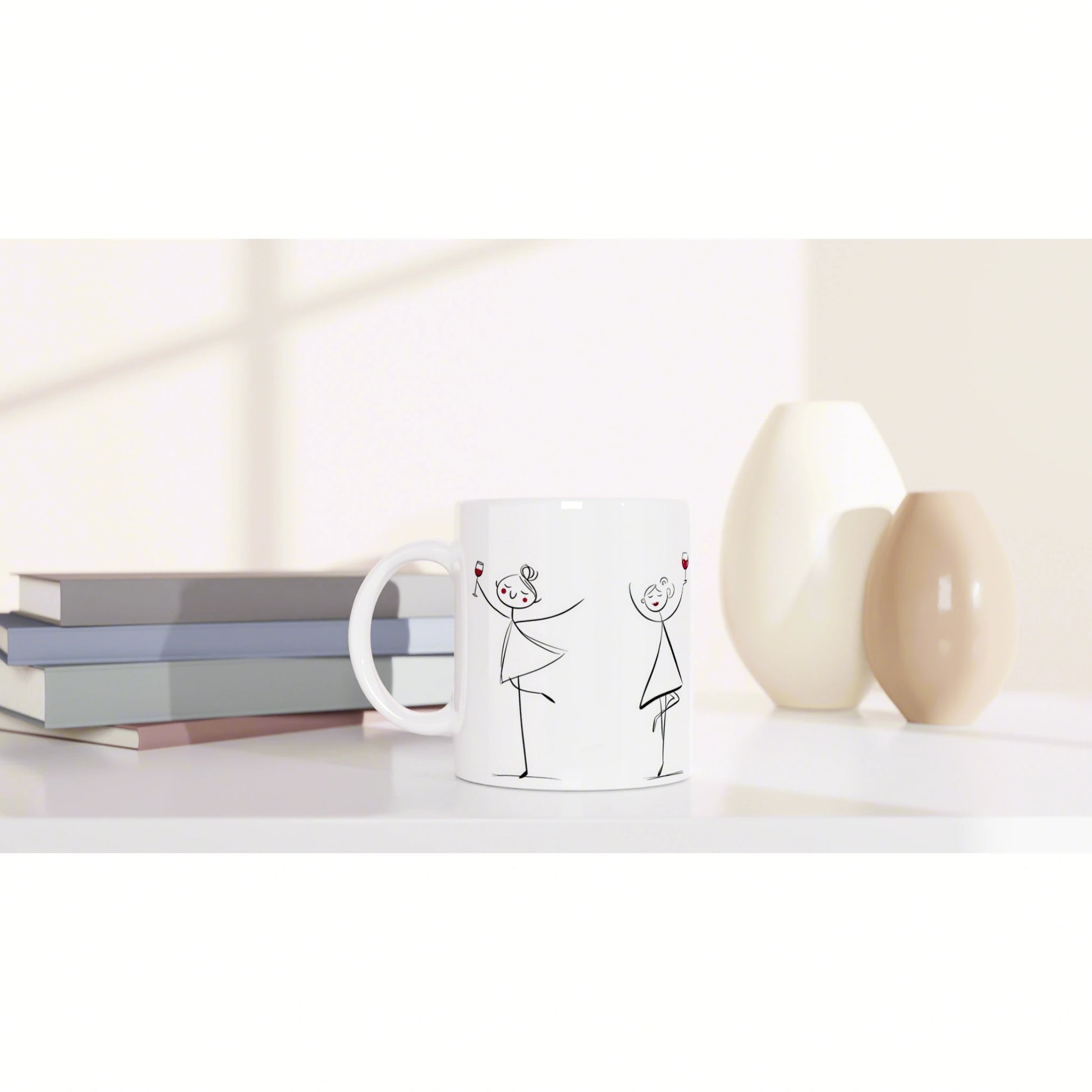White mug mockup with stick-figure dancing couple holding wine glasses, beside pastel vases and a stack of books.