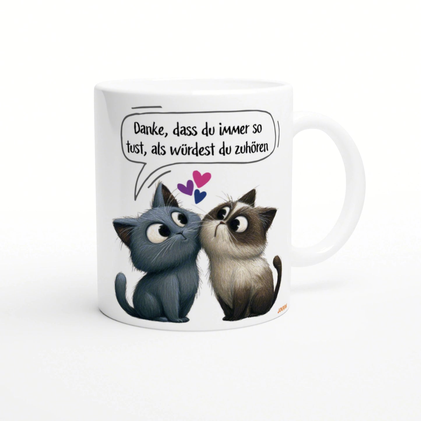 White mug featuring two cartoon cats looking at each other; speech bubble in German about pretending to listen.