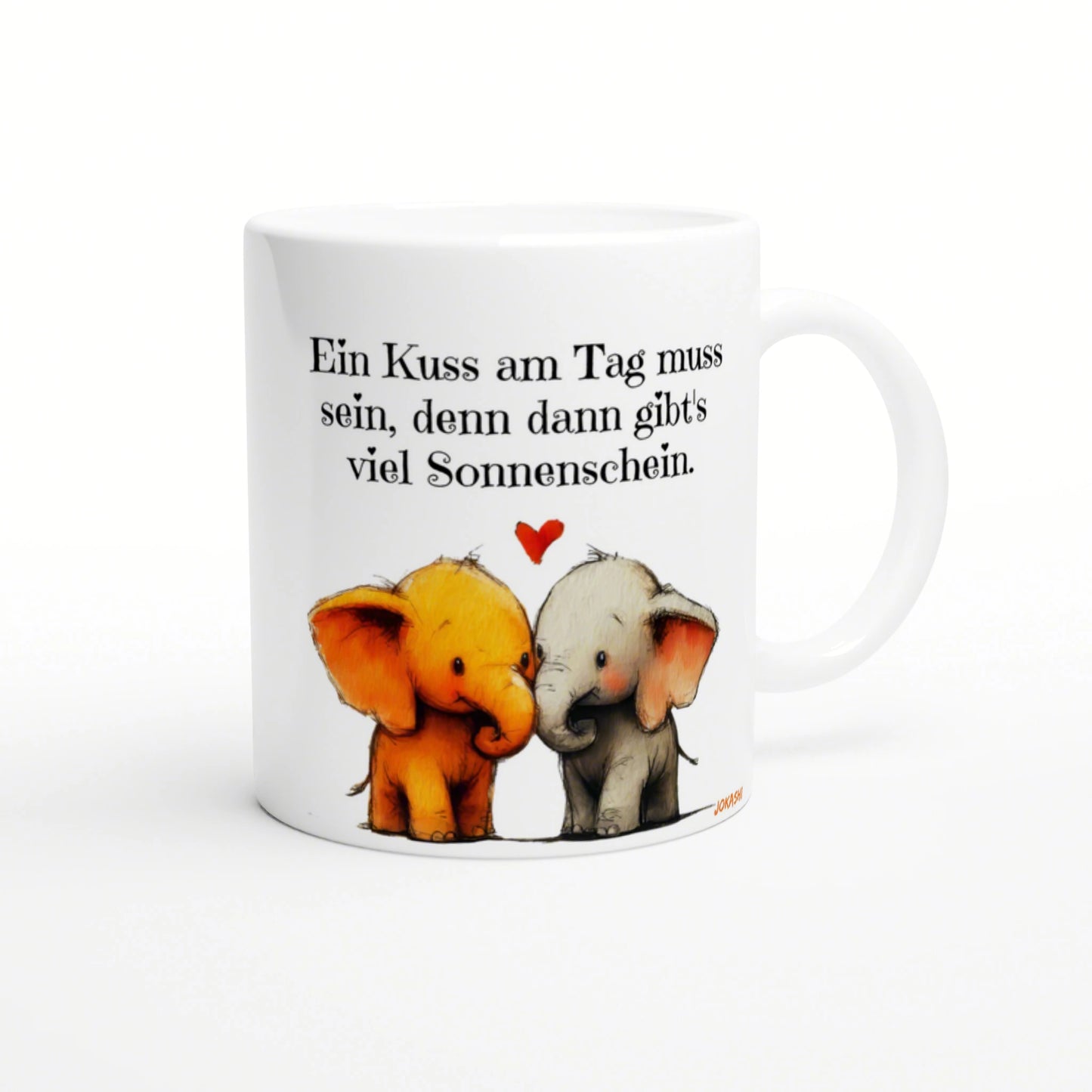 White mug featuring two cuddling elephants, a small red heart, and a German caption about kisses and sunshine.